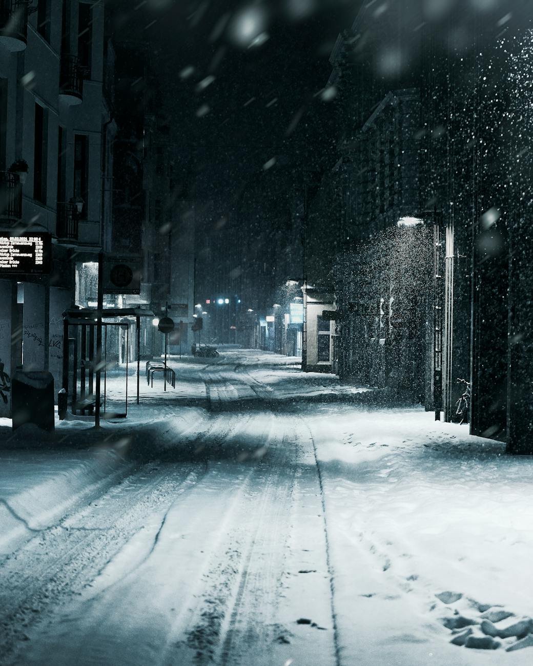 a snow covered road of a city